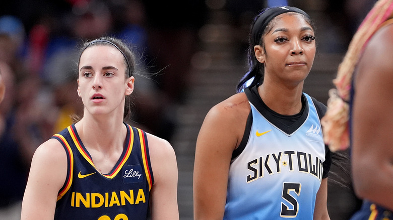 Caitlin Clark and Angel Reese walking on the basketball court