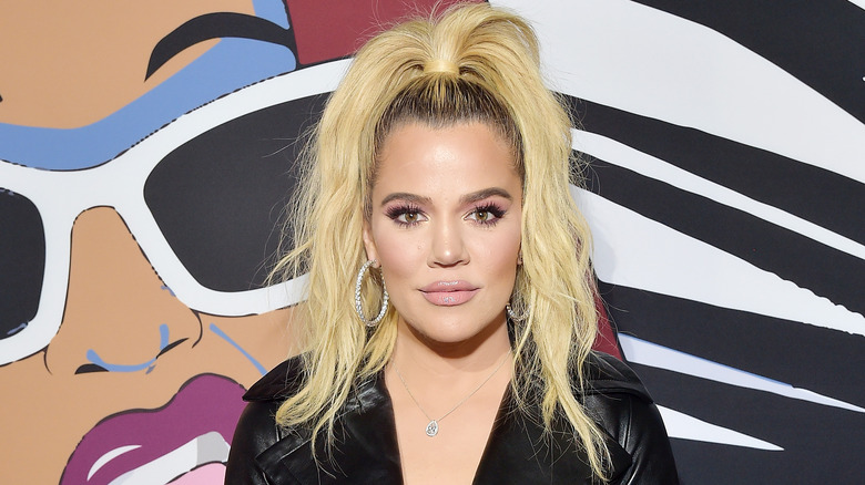 Khloé Kardashian wearing a half ponytail