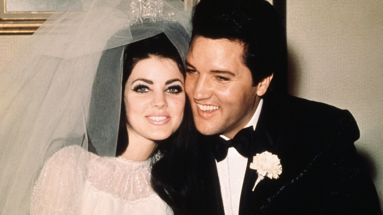 Priscilla Presley and Elvis Presley on their wedding day