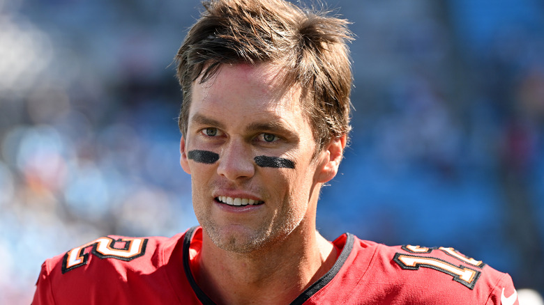 Tom Brady in football uniform, looking away