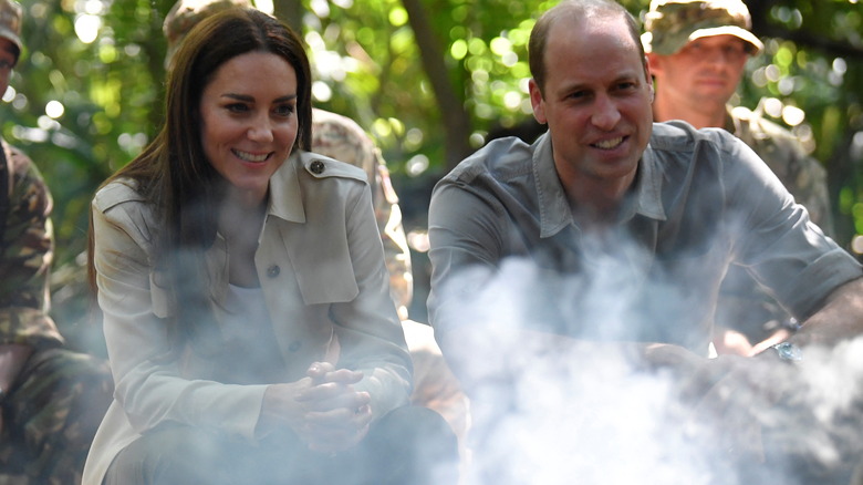 Kate Middleton and Prince William sitting by a fire