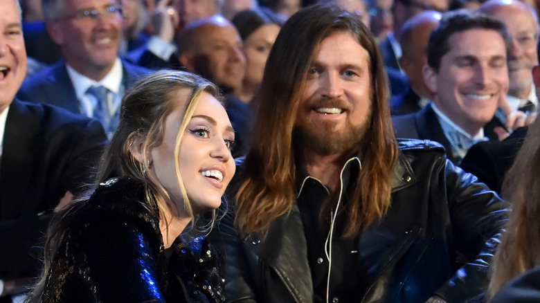 Miley and Billy Ray Cyrus smiling