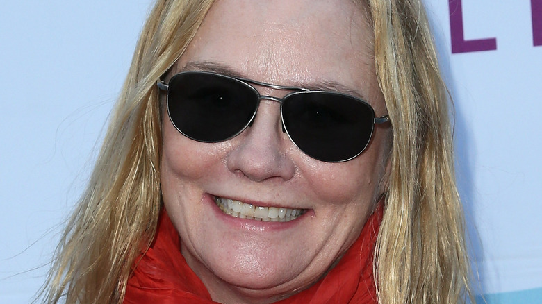 Cybill Shepherd smiling in aviator sunglasses