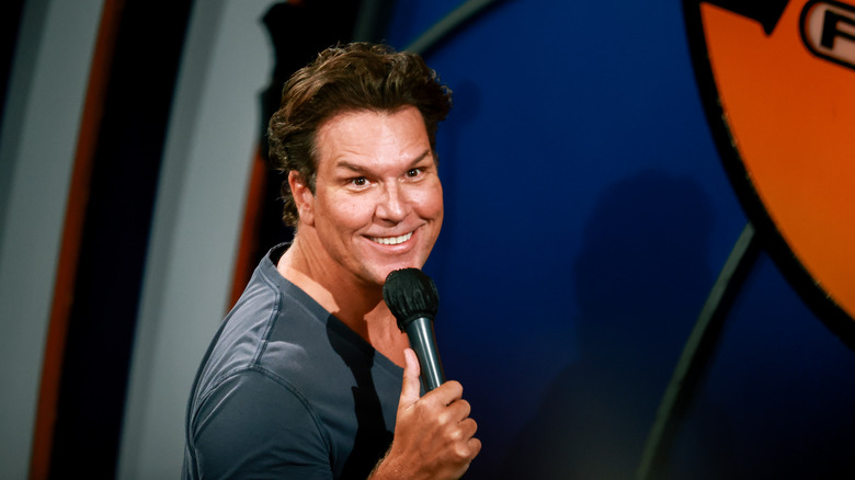 Dane Cook with goofy smile and mic