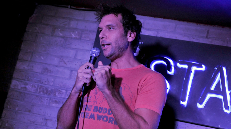 Dane Cook performs in purple light