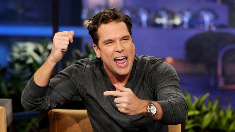 Dane Cook gesturing on a talk show