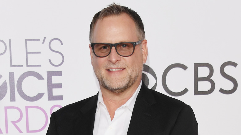 Dave Coulier smiling in sunglasses