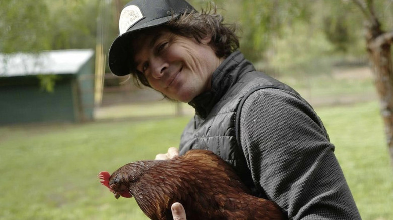 Ian Somerhalder holding a chicken