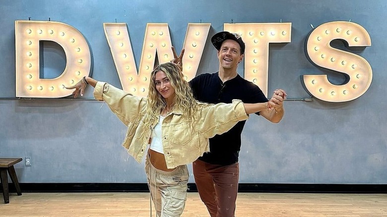 Jason Mraz and Daniella Karagach posing in the Dancing with the Stars rehearsal studio