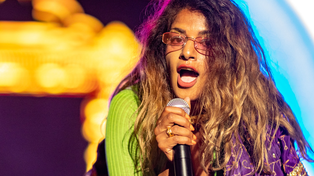 M.I.A. performing with pink sunglasses on