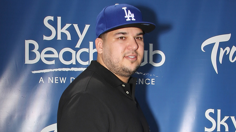 Rob Kardashian looking to the side at red carpet event