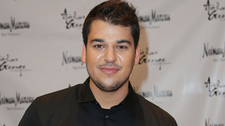 Rob Kardashian smiling in close-up at red carpet event