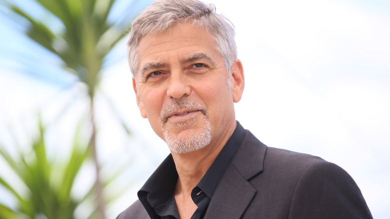 George Clooney looks on