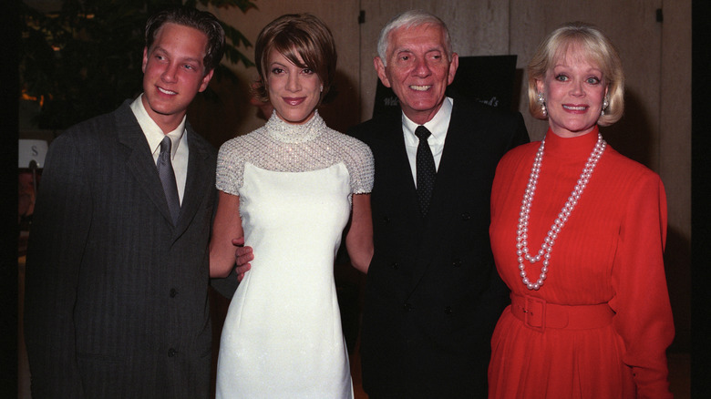 Randy Spelling posing alongside Tori, Aaron, and Candy Spelling