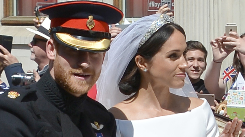 Prince Harry and Meghan Markle in wedding carrige