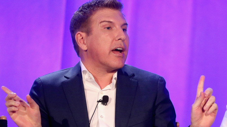 Todd Chrisley uses his hands while speaking