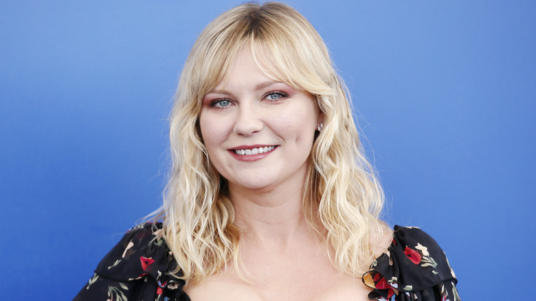 Kirsten Dunst flowery dress smiling