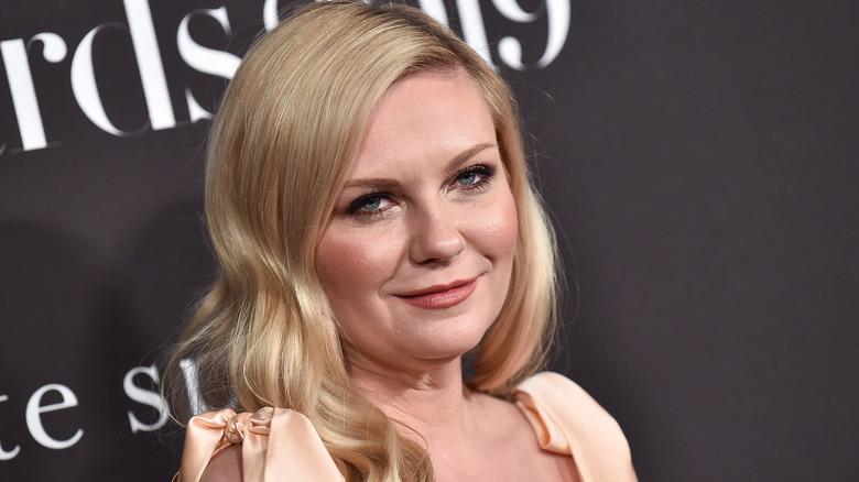 Kirsten Dunst peach dress smiling