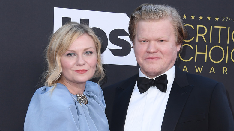 Kirsten Dunst and Jesse Plemons smart dress smiling