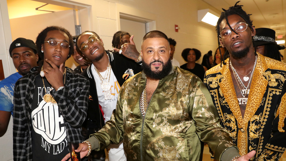 DJ Khaled and Migos at an event 
