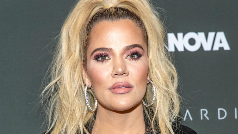 Khloe Kardashian posing at event