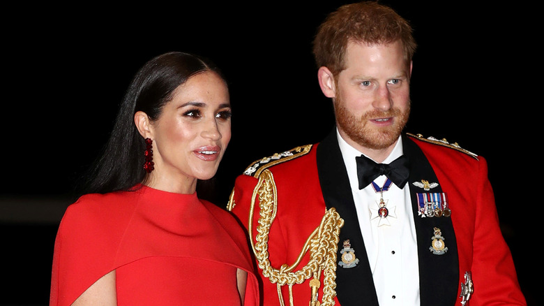 Meghan Markle and Prince Harry wearing red