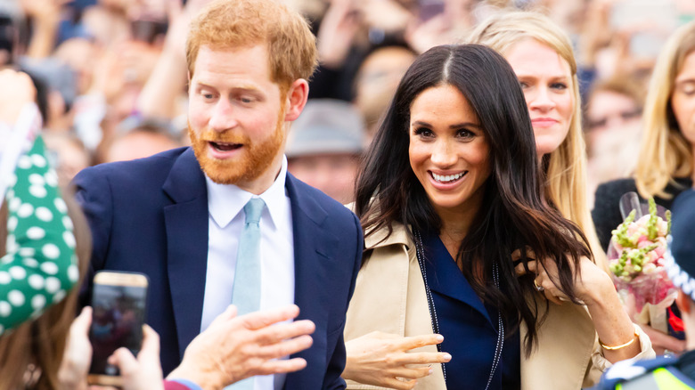 Prince Harry and Meghan Markle smiling