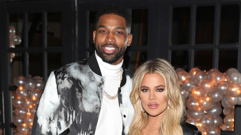 Tristan Thompson posing with Khloe Kardashian