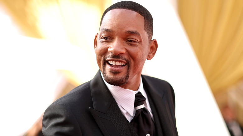 Will Smith smiling on the red carpet