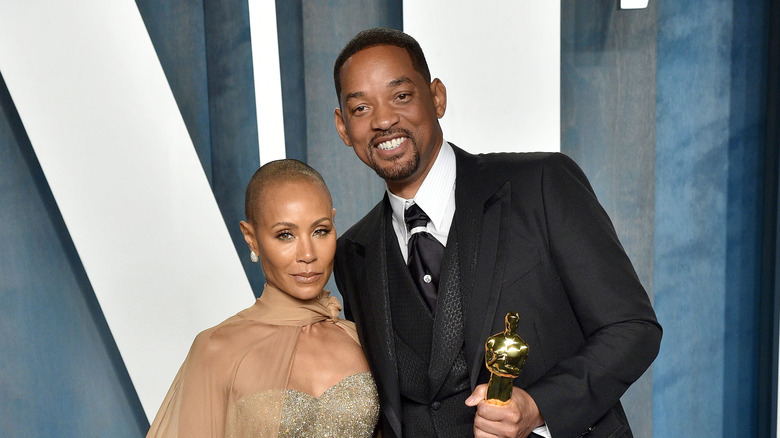 Jada and Will Smith posing together at the Oscars