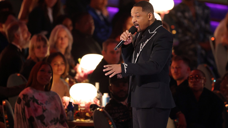 Will Smith speaking on stage at the 2025 Grammys.