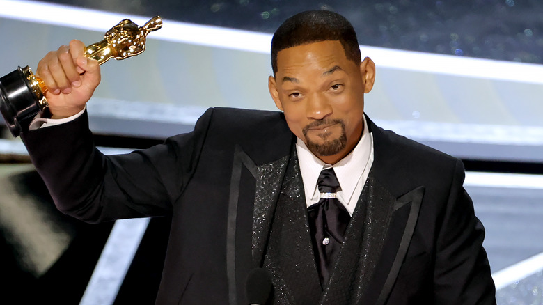 Will Smith posing with award