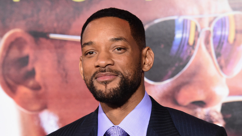 Will Smith posing on red carpet