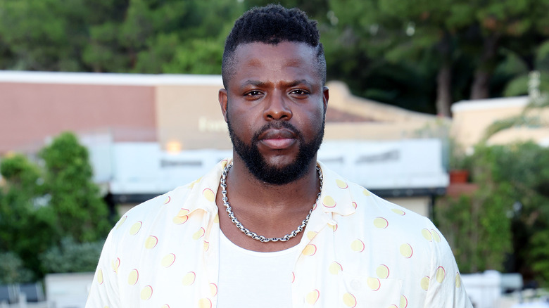 Winston Duke posing outdoors