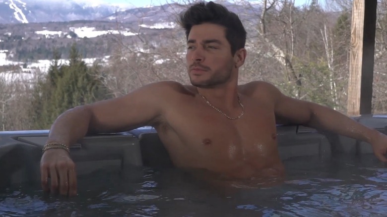 Andrea Denver pensive in a hot tub