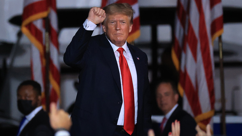 Donald Trump with raised fist during political speech