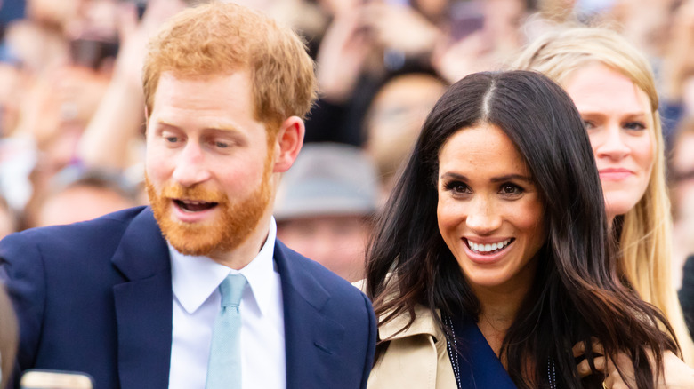 Prince Harry and Meghan Markle talking