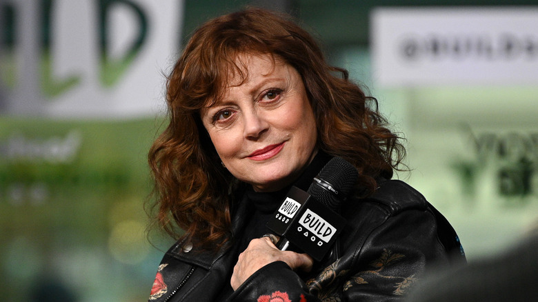 Susan Sarandon holding a microphone