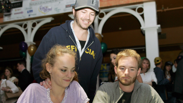 Danny Masterson behind Bijou Phillips, Christopher Masterson