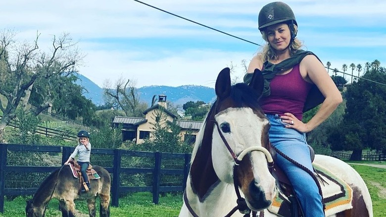 Bijou Phillips, daughter riding horses