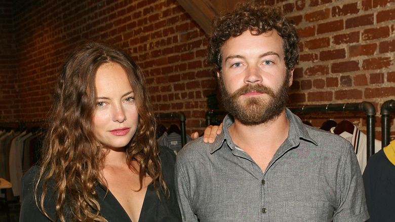 Bijou Phillips with hand on Danny Masterson's shoulder