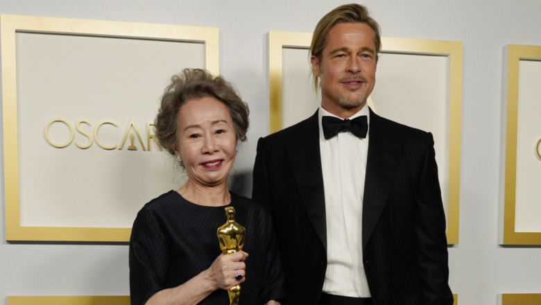 Yuh-Jung Youn poses with Brad Pitt