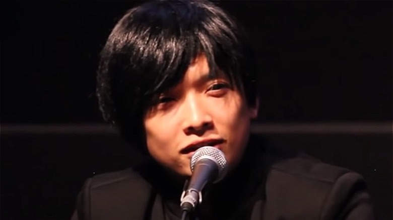 Monty Oum speaking into a mic 