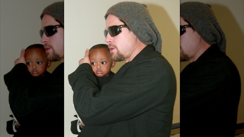 Brad Pitt cradling Zahara Jolie's head