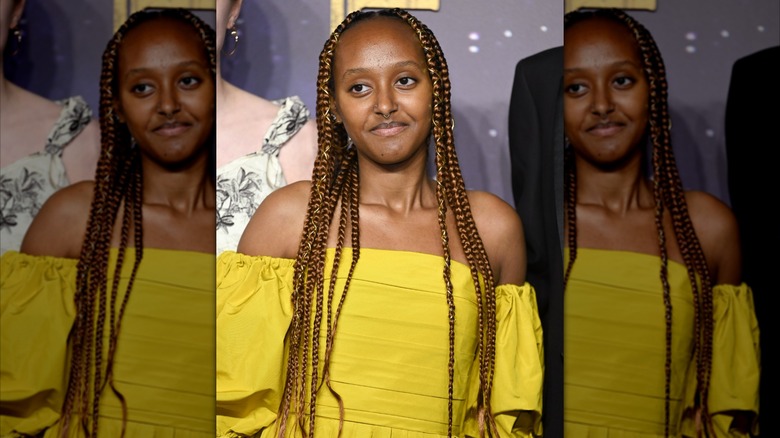 Zahara Jolie wearing yellow outfit with hair in braids at the Eternals U.K. Premiere