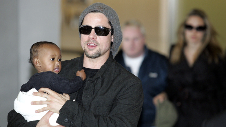 Brad Pitt holds baby Zahara