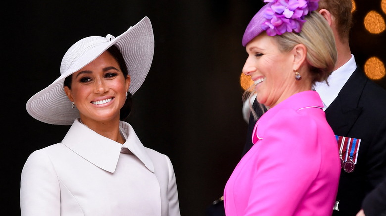 Meghan Markle and Zara Tindall smiling