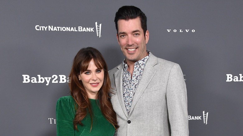 Zooey Deschanel and Jonathan Scott pose